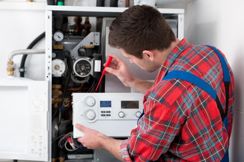 Gas Safe engineer working on a boiler in Belgravia